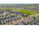 Expansive aerial view of a community showcasing well-maintained homes, green spaces, and neighborhood streets at 9391 E 59Th North Pl, Denver, CO 80238