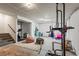 Spacious basement featuring a workout area with gym equipment and a comfortable seating area at 9391 E 59Th North Pl, Denver, CO 80238