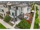 Modern three-story home with balconies, solar panels, and a deck area perfect for outdoor entertaining at 9391 E 59Th North Pl, Denver, CO 80238