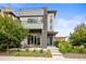 Charming three-story home with a covered front porch and modern architectural details at 9391 E 59Th North Pl, Denver, CO 80238
