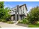Stunning modern home boasts stylish architecture, lush landscaping, and a welcoming front porch, perfect for relaxing outdoors at 9391 E 59Th North Pl, Denver, CO 80238