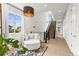 Open hallway featuring reading nook, high ceilings, large window, and staircase at 9391 E 59Th North Pl, Denver, CO 80238
