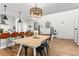 Stylish kitchen with a large island, stainless steel appliances, and open access to the staircase at 9391 E 59Th North Pl, Denver, CO 80238