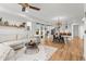 Bright open-concept living room with a contemporary kitchen and dining area, perfect for entertaining at 9391 E 59Th North Pl, Denver, CO 80238