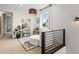 Cozy living space with reading nook, modern shelving, and natural light at 9391 E 59Th North Pl, Denver, CO 80238