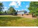 Backyard with large grassy area and partial patio at 4522 S Robb St, Littleton, CO 80127