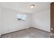 Bedroom with a window with curtains, neutral carpet and white walls at 4522 S Robb St, Littleton, CO 80127
