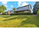 Two-story home with brick and blue siding, featuring a two-car garage and a well-manicured front lawn at 4522 S Robb St, Littleton, CO 80127