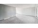 Bright living room with neutral carpet and light gray walls at 4522 S Robb St, Littleton, CO 80127