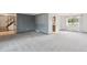 Spacious living room with stairs and a window overlooking the yard at 4522 S Robb St, Littleton, CO 80127
