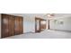 Spacious main bedroom with neutral carpet, a ceiling fan and closet at 4522 S Robb St, Littleton, CO 80127