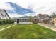 The property features a lush backyard and an enclosed sunroom connected to the main house at 4453 Fillmore St, Denver, CO 80216