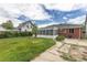 Spacious backyard with a partial patio and screened-in porch, perfect for outdoor relaxation and entertaining at 4453 Fillmore St, Denver, CO 80216