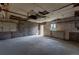 Unfinished basement featuring concrete walls and floors, offering a blank canvas for customization and storage at 4453 Fillmore St, Denver, CO 80216