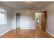 This bright bedroom offers hardwood floors and a view of the ensuite bathroom and walk-in closet at 4453 Fillmore St, Denver, CO 80216