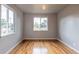 This bedroom has hardwood floors and two windows allowing for natural light at 4453 Fillmore St, Denver, CO 80216