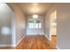 Inviting dining room features refinished hardwood floors and a modern pendant light fixture at 4453 Fillmore St, Denver, CO 80216