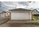 Detached garage featuring a white door and neutral-colored walls providing ample space for parking and storage at 4453 Fillmore St, Denver, CO 80216