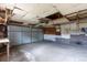 Spacious garage interior with concrete floors and overhead door, offering ample space for parking and storage at 4453 Fillmore St, Denver, CO 80216