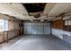 Empty garage interior with a large door and workbench space offering storage and functionality at 4453 Fillmore St, Denver, CO 80216