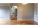 Bright living room features hardwood floors, light grey walls, and arched doorways at 4453 Fillmore St, Denver, CO 80216