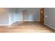 The living room features hardwood floors, light grey walls, and an arched doorway at 4453 Fillmore St, Denver, CO 80216