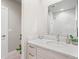 Modern bathroom featuring a sleek vanity, marble walk-in shower and contemporary fixtures at 4733 E Iliff Ave, Denver, CO 80222