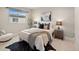 Inviting bedroom with natural light, stylish decor, and a comfortable bed at 4733 E Iliff Ave, Denver, CO 80222