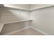 Walk-in closet with shelving and rods for optimal storage at 4733 E Iliff Ave, Denver, CO 80222