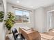 Well-lit office featuring a modern desk, chair, and a bright window overlooking the neighborhood at 4733 E Iliff Ave, Denver, CO 80222