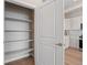 Open pantry with shelving next to the kitchen at 4733 E Iliff Ave, Denver, CO 80222