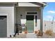 Inviting front porch featuring outdoor seating, potted plants, and a Ring doorbell security system at 19055 E 55Th Ave, Denver, CO 80249