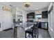 Kitchen features a granite island, stainless steel appliances, dark wood cabinets, and wood grain flooring at 19055 E 55Th Ave, Denver, CO 80249