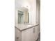 Bathroom featuring a modern vanity with neutral countertop, mirror, and fixtures at 3198 Blake St # 502, Denver, CO 80205