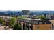 Modern apartment building exterior with city views and lush green trees at 3198 Blake St # 502, Denver, CO 80205