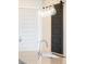 Close-up of kitchen island with a sink, countertop, stylish lighting, and sliding barn door at 3198 Blake St # 502, Denver, CO 80205