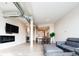 Open-concept living and dining area with wood floors, large windows, and a modern design at 3198 Blake St # 502, Denver, CO 80205