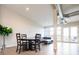 Spacious living area featuring a dining table, couch, and large windows for natural light at 3198 Blake St # 502, Denver, CO 80205