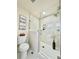 Modern bathroom with a glass-enclosed shower and white subway tile at 1630 S Valentine Way, Lakewood, CO 80228