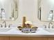 Sleek double vanity with modern faucets and mirrors creates a luxurious bathroom at 1630 S Valentine Way, Lakewood, CO 80228