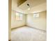 Bright bedroom with neutral walls and plush carpet, illuminated by natural light at 1630 S Valentine Way, Lakewood, CO 80228