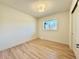 Bright bedroom with natural light from window and hardwood floors at 1630 S Valentine Way, Lakewood, CO 80228