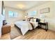 Spacious main bedroom with a cozy rug, decorative pillows, and ample natural light at 1630 S Valentine Way, Lakewood, CO 80228