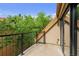 A balcony overlooks lush greenery, providing a serene outdoor space at 3299 Lowell Blvd # 204, Denver, CO 80211
