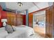 Bedroom featuring two closets and an open entryway into a living space at 3299 Lowell Blvd # 204, Denver, CO 80211