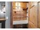 Walk-in closet with custom shelving, quartz counters and wood planking at 3299 Lowell Blvd # 204, Denver, CO 80211