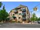 The building boasts multiple balconies and a mix of residential and commercial spaces at 3299 Lowell Blvd # 204, Denver, CO 80211