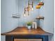 Hallway with small wooden shelves, lights, and decorative pieces at 3299 Lowell Blvd # 204, Denver, CO 80211