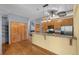 Bright kitchen with wood cabinets, granite counters, stainless appliances and breakfast bar at 3299 Lowell Blvd # 204, Denver, CO 80211