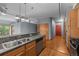 Open kitchen with granite counters, stainless steel appliances, and a view into the spacious living area at 3299 Lowell Blvd # 204, Denver, CO 80211